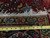 8x11 Persian Heriz rug measured with a tape, showing tight knotting and white cotton fringe