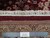 Back of the hand-knotted rug with ruler and authentic handmade label showing cotton foundation
