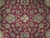 Close-up of wool pile showing ivory rosette, olive palmettes and curling vines on red ground