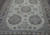 9'4" x 11'9" Khotan rug detail showing ivory field, pomegranate trees and blue medallions