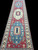 Red 20 foot hallway runner with triple medallion Yakash Kazak design and navy floral guard borders