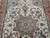 Central medallion close-up with 8 petal rosette, sky blue leaves and taupe cartouche detailing