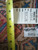 Back tag reading rug number 5802 with tape measure against hand-knotted wool pile