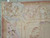 Corner detail of the rose border with woven flower cartouches, acanthus leaves and flat tapestry surface