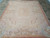 Living room sized 8x10 Aubusson area rug photographed flat, showing balanced medallion and wide floral border