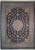 Navy blue floral medallion wool rug with sky blue border and ivory fringe, photographed flat overhead