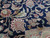 Detail of navy field showing palmettes, curling leaves and scrolling vines in salmon, ivory and sage