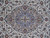 Close-up of powder blue lobed medallion with navy outlines, olive vines and small red rosettes