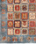 Corner detail showing square panels with tree motifs beside a blue border of boteh figures