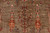 Detail of cypress and candelabra trees woven in red, green and gold Ghazni wool pile