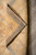 Folded back corner revealing the tight hand-knotted weave, cotton foundation and low 5/16 inch wool pile