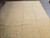 8'7" x 11'7" Pakistani Chobi rug in warm light, golden beige field, subtle vine tracery