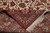Folded corner revealing the fine hand-knotted back, tight weave density and ivory fringe end