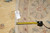 Back of the round rug with tape measure and genuine hand woven Oriental rug tag