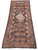 The 5'10" x 13' antique Qashqai rug laid flat, showing connected tribal medallions and original fringe