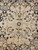 7'4" x 10' Tabriz rug field detail with 8 petal rosettes and black starburst center