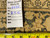 Back tag reading rug number 6482 and size 7.4 x 10 beside a tape measure