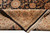 Folded corner revealing the fine even knotting on the back of this wool rug