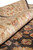 Rolled edge detail showing short dense pile and hand-spun wool in camel and rust