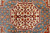 Ivory eight point star medallion on sky blue ground framed by rust, finely knotted wool