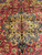 11'3" x 14'6" Tabriz rug central gold medallion on deep red field with navy outlines