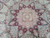 Detail of central star medallion showing silk highlighted palmettes, rosettes and fine even knotting