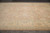 Soft clay field and wheat ivory border shown at floor level on hand-knotted wool Ziegler rug