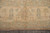 Ivory main border with sage guard stripes, stylized flowers and natural fringe along the end