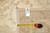 Back tag reading 10.2 by 14.5 with tape measure beside the woven cotton fringe