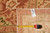 Reverse corner with dealer tag reading 10-3 by 13-9 beside a tape measure