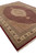 Hand-knotted Mahi Tabriz rug photographed from the corner, deep red outer band and cream cotton fringe visible