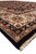 Side angle of 9x13 rug edge showing selvage, black outer band and ivory fringe