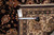 Back tag and tape measure against the reverse, showing knot density of this handmade rug