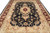 Close top-down view of ivory spandrels, allover vine scroll and deep navy floral field