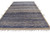 Angled floor view of this 8x12 Moroccan style rug showing indigo and taupe banding