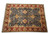 Traditional all-over floral design in gold, sage green and apricot across a dark blue field