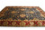 Room scale view of the large Indian hand-knotted wool rug photographed from one long corner