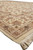 Perspective view of border corner showing guard stripes, rosettes and thick plush pile