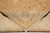 Folded corner showing cotton foundation, fine knotting and clean ivory fringe on the reverse side