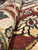 Rolled pile close-up showing rust, ivory and gold border wool at 3/8 inch height