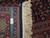 Back of 8x10 Bijar rug with ruler, authentic hand knotted tag and cotton fringe