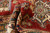 Rolled pile detail showing dense hand-spun wool, thick handle and saturated red and ivory tones