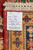 Back label confirming 12'5 x 9 feet, 380 x 274 cm, hand-knotted in Pakistan