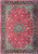 Red field Persian Isfahan rug with navy border and layered blue floral medallion in wool