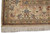 Border corner detail with woven signature cartouche, blue palmettes and salmon floral vinework