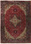Full overhead view of red Persian Tabriz rug with ivory geometric medallion and navy floral border