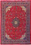 Red Persian Sarouk rug with navy floral medallion and ivory corner spandrels shown flat overhead