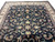 Room-scale view of the 9'10" x 14'2" Kashan design rug showing its symmetrical floral layout
