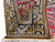 Border corner with leopards, peacocks and palmettes on navy ground beside camel gold band