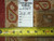 Back tag reading hand woven Oriental rug number 6364, size 9.10 x 14, beside measuring tape
